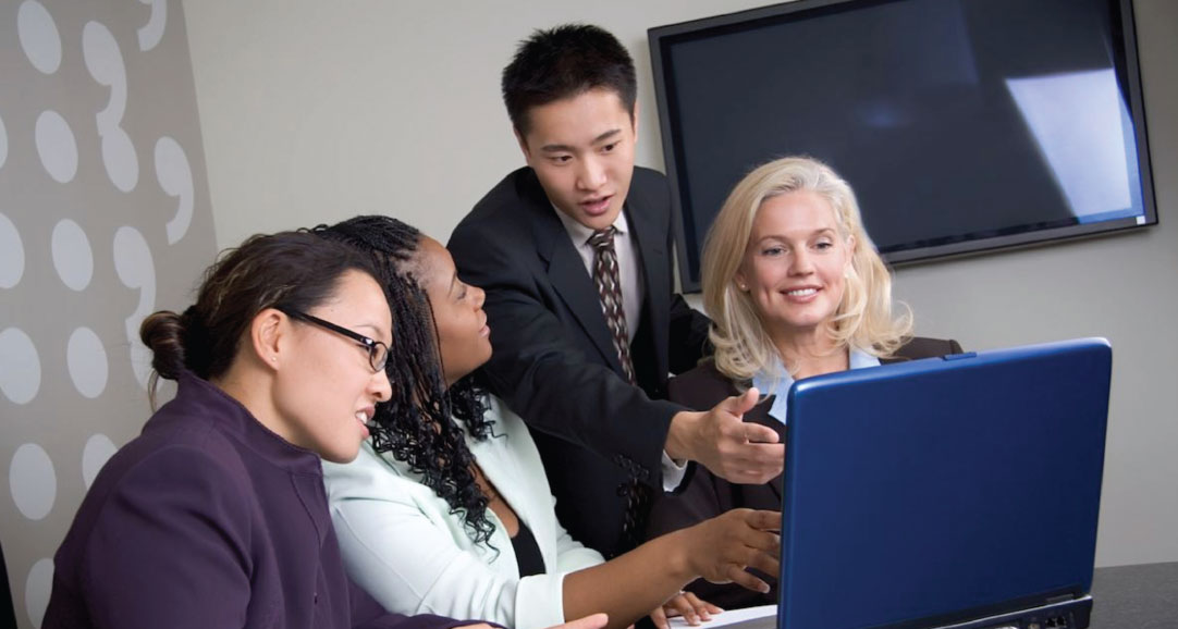 photo of people discussing client tradeshow booth display project
